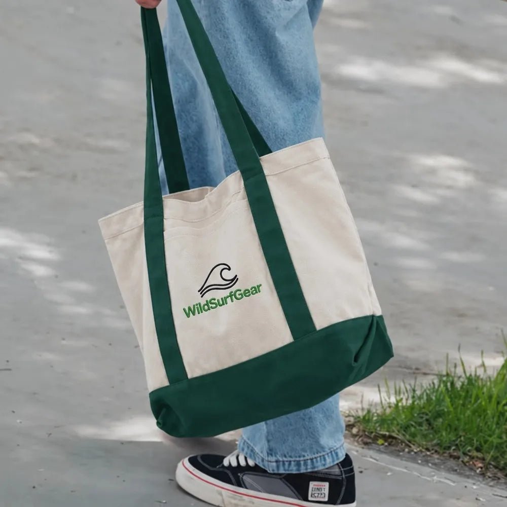 WildSurfGear canvas tote bag carried outdoors close-up